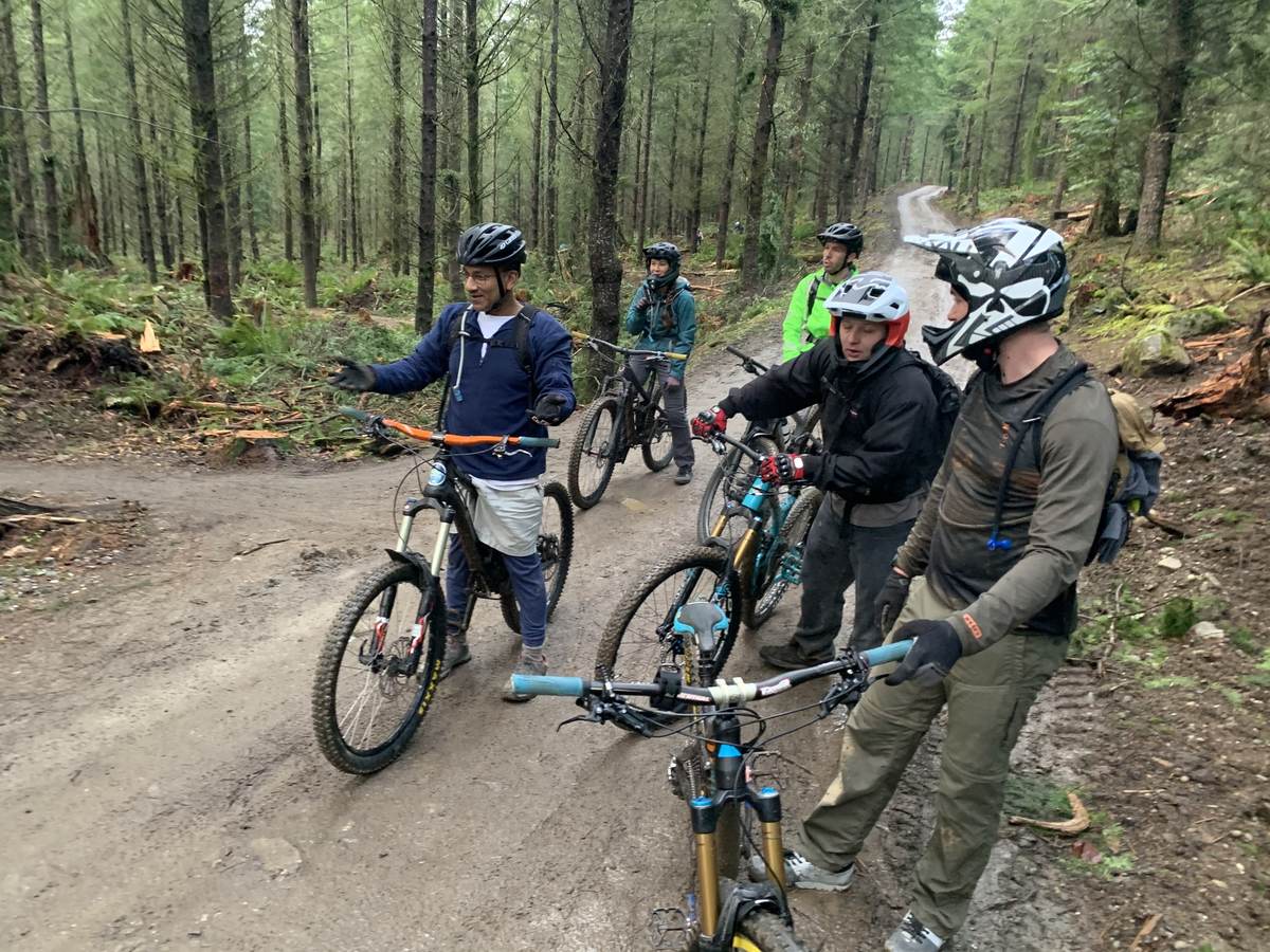 Riders circled up mid-trail for a trail talk