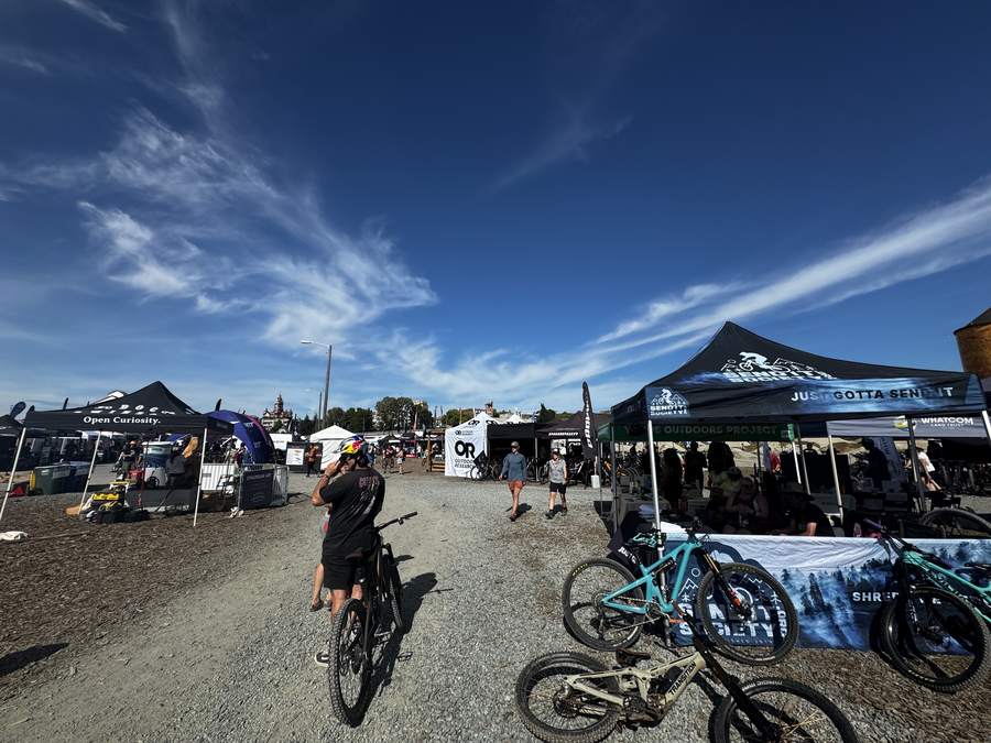 Send It Society booth among the tents at NW Tune-Up on the Bellingham waterfront