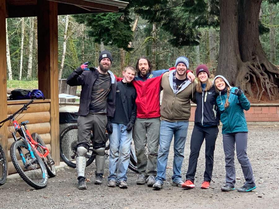 The crew all smiles after a rainy ride
